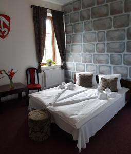 Postel nebo postele na pokoji v ubytování Hotel Camelot