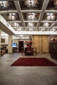 TV a/nebo společenská místnost v ubytování Titagion Hotel