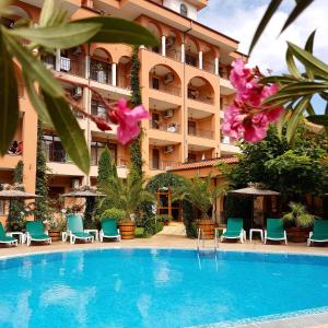 a hotel with a swimming pool in front of a building at Hotel Liani - All Inclusive in Sunny Beach