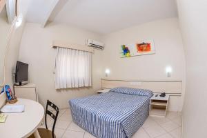 Postel nebo postele na pokoji v ubytování Hotel Express Canoas