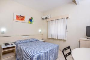 Postel nebo postele na pokoji v ubytování Hotel Express Canoas + 21 fotografií