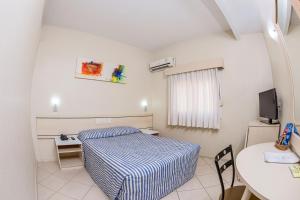 Postel nebo postele na pokoji v ubytování Hotel Express Canoas