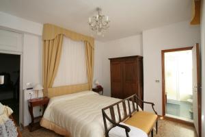 מיטה או מיטות בחדר ב-Hotel Roma