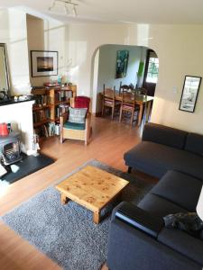 a living room with a couch and a coffee table at Ban Milis 1 in Fethard on Sea