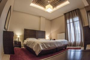 Postel nebo postele na pokoji v ubytování Titagion Hotel