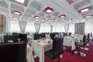 Restoranas ar kita vieta pavalgyti apgyvendinimo įstaigoje Gran Carlina Hotel