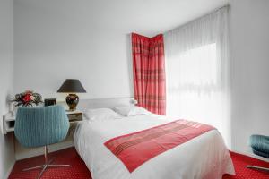 Un ou plusieurs lits dans un hébergement de l'établissement Gran Carlina Hotel