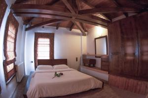 Postel nebo postele na pokoji v ubytování Titagion Hotel