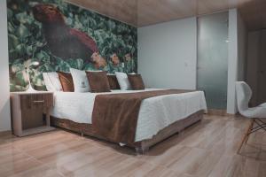 Voodi või voodid majutusasutuse HOTEl PACHAMAMA SPA toas