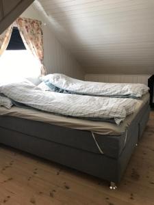 Ліжко або ліжка в номері Koselig Landsbyhus i Nordfjord