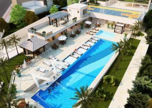 una vista aérea de un complejo con piscina en Excelente Apartamento Férias, praia e Beto Carrero, en Penha