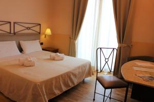Katil atau katil-katil dalam bilik di Hotel Semifonte