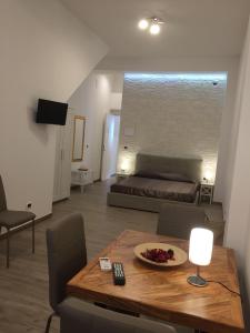 Televízia a/alebo spoločenská miestnosť v ubytovaní Taormina holidays