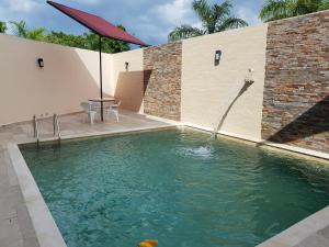 Bazén v ubytovaní Hotel Boutique La Toja Campeche alebo v jeho blízkosti