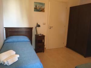 Letto o letti in una camera di Borgo Marino Plemmirio