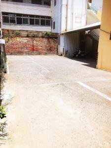 an empty parking lot in front of a building at Holiday Business Hotel in Taitung City