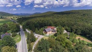 an aerial view of a house in the mountains at Plitvice Rooms Family Glumac in Plitvička Jezera