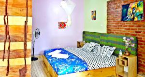 Postel nebo postele na pokoji v ubytování Yambi Guesthouse