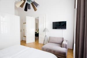 Postel nebo postele na pokoji v ubytování Studio Apartments Urania - Mai's Apartments