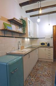 a kitchen with a sink and a counter top at Bonito Loft en L'Ampolla in L'Ampolla