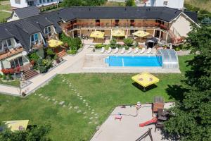 an aerial view of a house with a swimming pool at Perła Bałtyku in Pustkowo