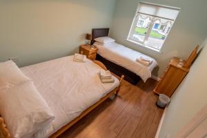 Giường trong phòng chung tại An Sean Ostan Apartments