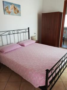 Postel nebo postele na pokoji v ubytování le tre torri