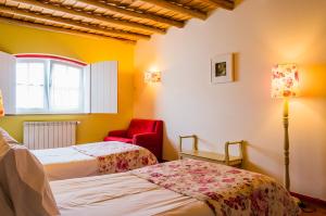 Cama ou camas em um quarto em Casa Da Padeira - Turismo Rural mais 37 fotos