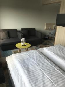 
A bed or beds in a room at ArenaHotellet i Uppsala
