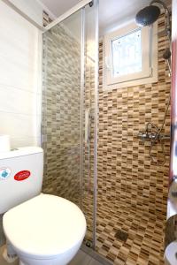 Koupelna v ubytování Hotel Karyatides