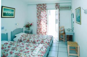 Postel nebo postele na pokoji v ubytování King Thiras Hotel