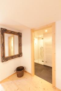 
a bathroom with a sink, toilet and tub at Hotel Posta in Sedrun
