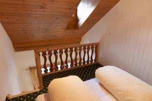 سرير أو أسرّة في غرفة في Hotel Posta