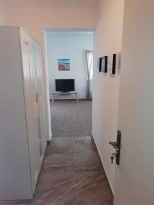 TV a/nebo společenská místnost v ubytování Apartmány U Stříbrných