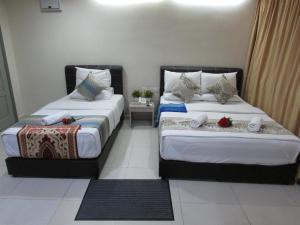 Postel nebo postele na pokoji v ubytování Safari Hotel