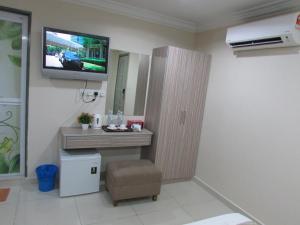 TV a/nebo společenská místnost v ubytování Safari Hotel