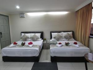 Postel nebo postele na pokoji v ubytování Safari Hotel