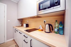 Kuchyňa alebo kuchynka v ubytovaní Apartamenty Bliżej Morza