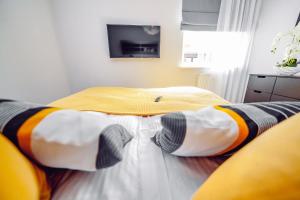 Posteľ alebo postele v izbe v ubytovaní Apartamenty Bliżej Morza