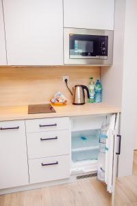 Kuchyňa alebo kuchynka v ubytovaní Apartamenty Bliżej Morza