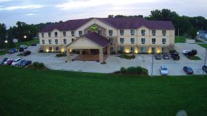 an aerial view of a large building with a parking lot at Countryview Inn & Suites in Robinson