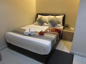 Postel nebo postele na pokoji v ubytování Safari Hotel