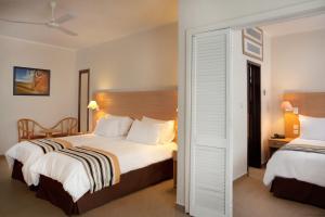 Кровать или кровати в номере The Preluna Hotel