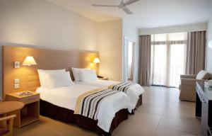 Кровать или кровати в номере The Preluna Hotel