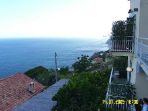 a view of the ocean from a building at Locanda Degli Agrumi in Conca dei Marini