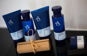 a group of three bottles of hair products on a table at Waterfront Southport Hotel in Southport