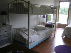 a bedroom with two bunk beds in a room at Chambres d'hotes du Moulin in Saint-Julien-sur-Cher