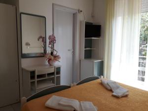 Postel nebo postele na pokoji v ubytování Hotel Admiral
