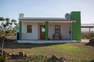 a small house with green and white paint at Windfall Wine Farm in Robertson