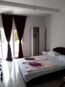 Postel nebo postele na pokoji v ubytování Apartmani Andrea-jaz